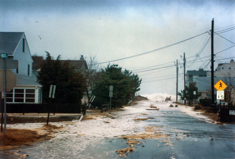 The ocean breaches Swedes Street during an early 1990s nor’easter. After a couple bad storms, town residents overwhelmingly passed a referendum leading to a beach replenishment tax in 1992. PAT WRIGHT PHOTO
